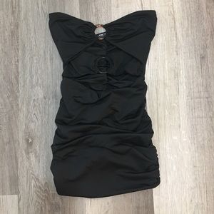 Black a scrunchy mini dress with cutouts.